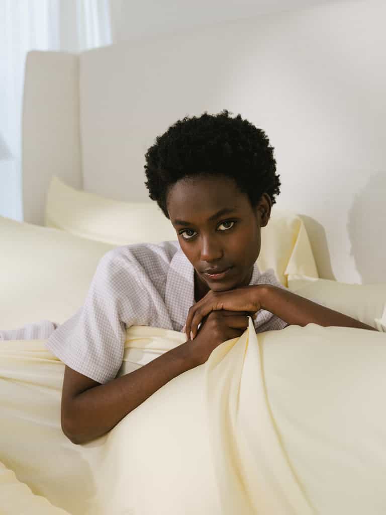 Women laying on bed with lemonade bedding |Color:Lemonade