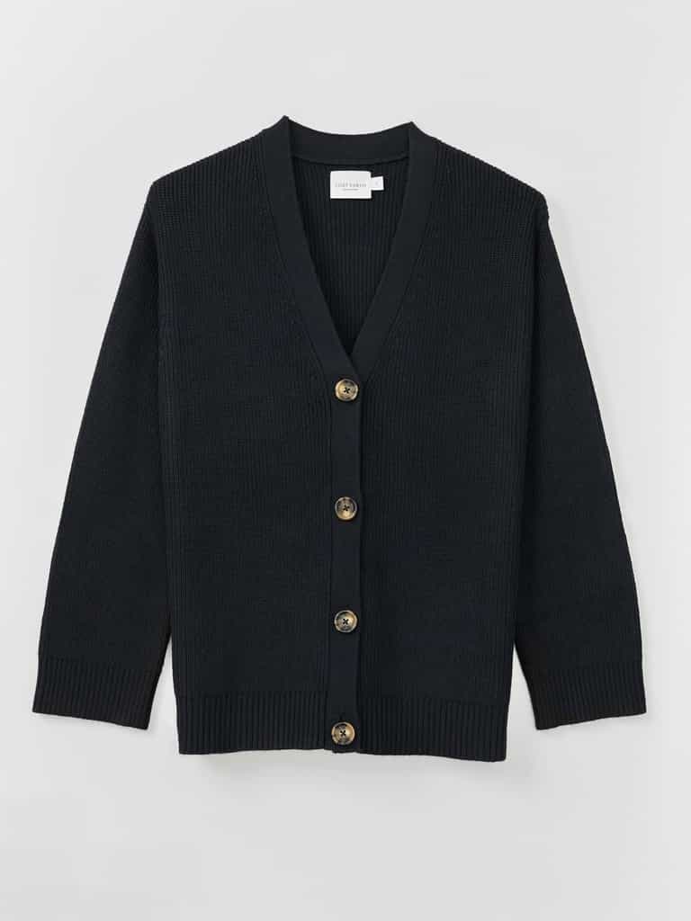 A Cozy Earth Classic Cardigan in Black lies on a white background |Color:Black