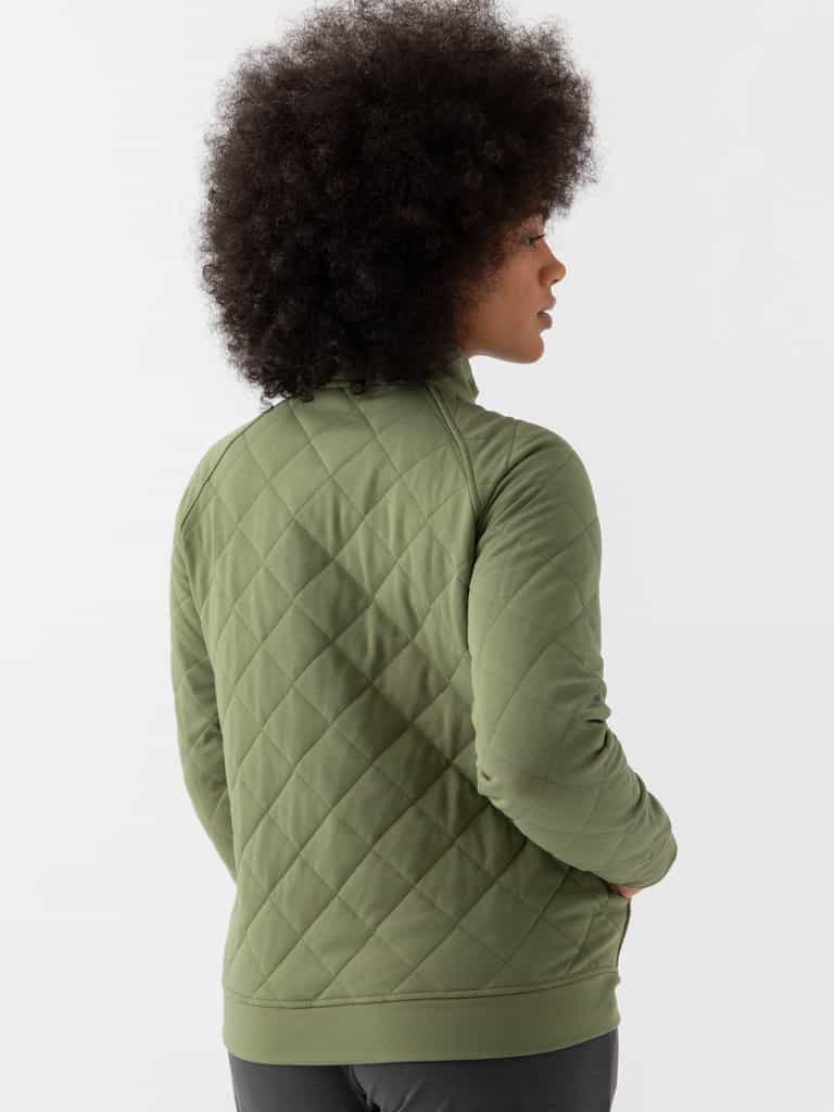 Woman wearing a green Cozy Earth Brushed Bamboo Quilted Pullover against a white background |Color:Juniper