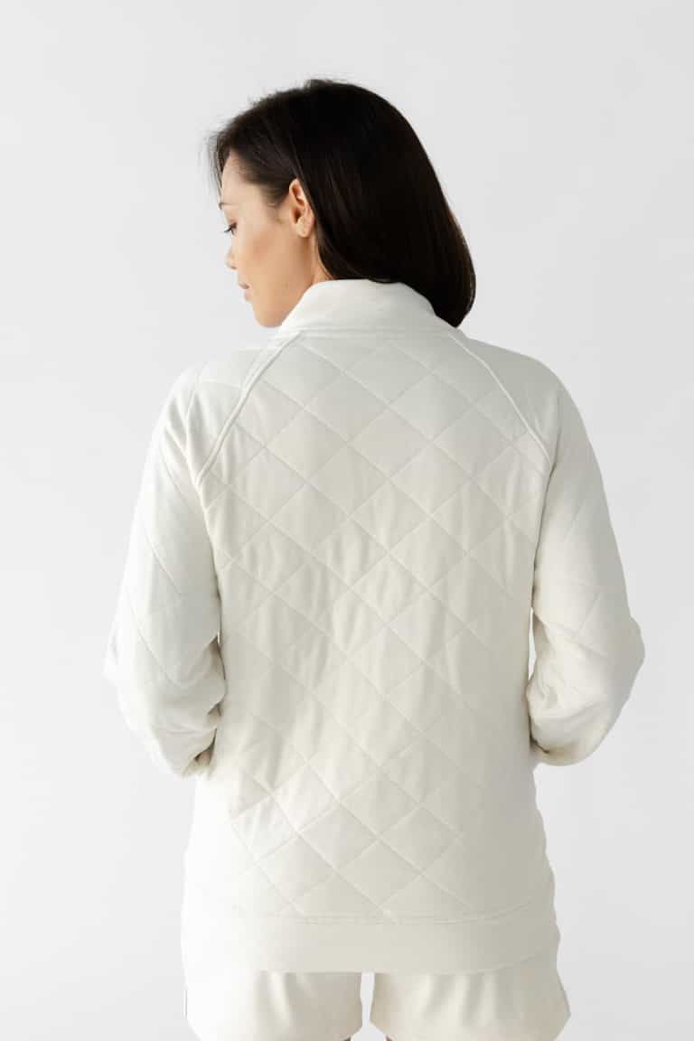 Woman wearing a white Cozy Earth Brushed Bamboo Quilted Pullover against a white background |Color:Ivory