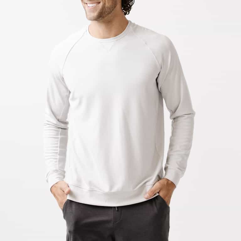 Light Grey/Charcoal Men's Bamboo Jogger Set. There is a man wearing the jogger set. He is standing in a well lit room in a home.|Color:Light Grey