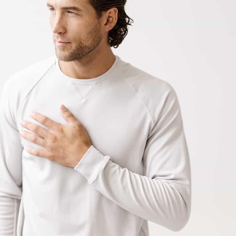 Light Grey Men's Bamboo Jogger Set. There is a man wearing the jogger set. He is standing in a well lit room in a home.|Color:Light Grey