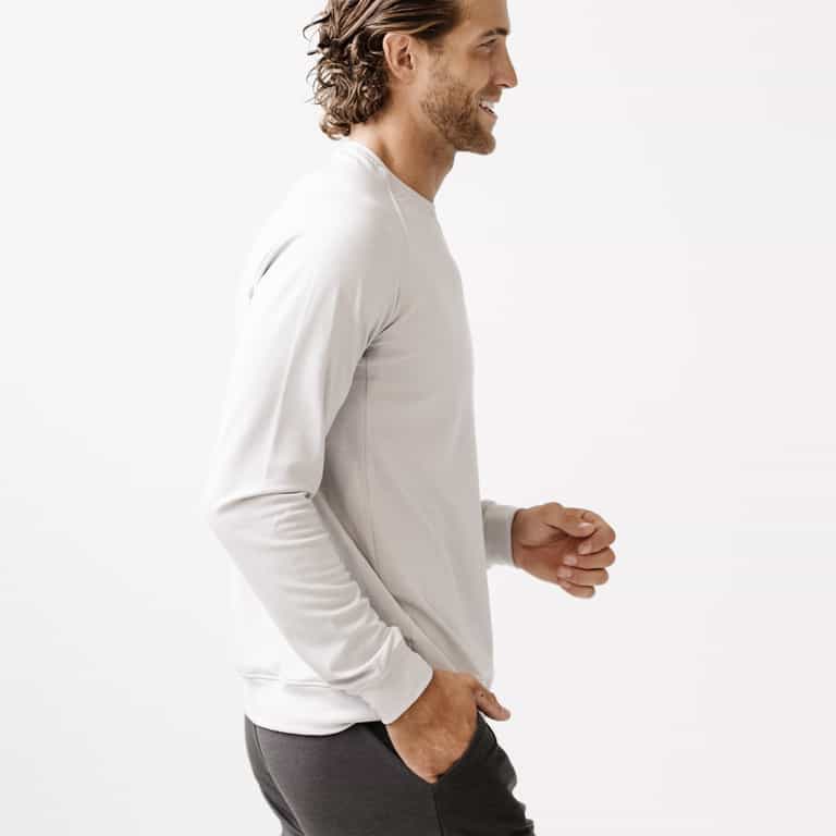 Light Grey/Charcoal Men's Bamboo Jogger Set. There is a man wearing the jogger set. He is standing in a well lit room in a home.|Color:Light Grey