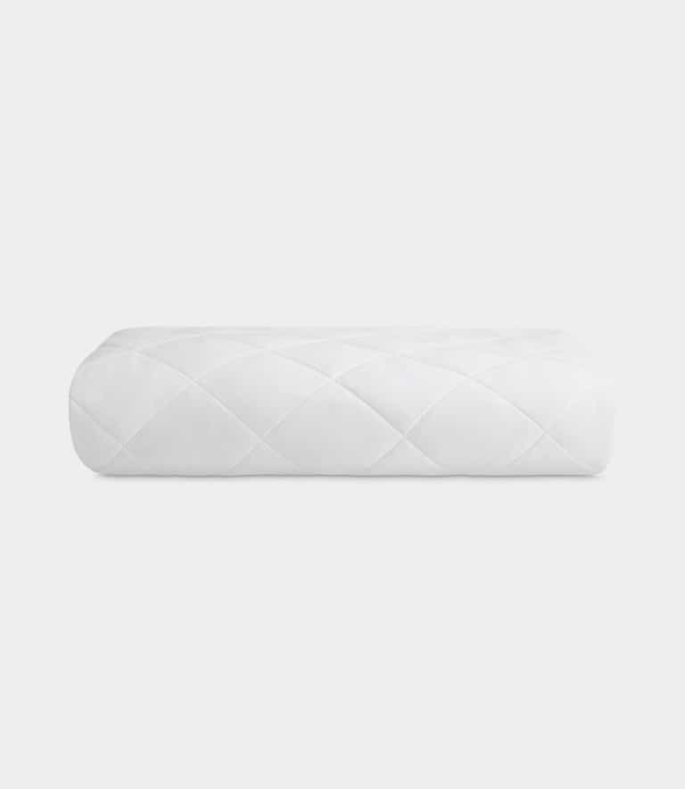 Mattress pad folded with white background