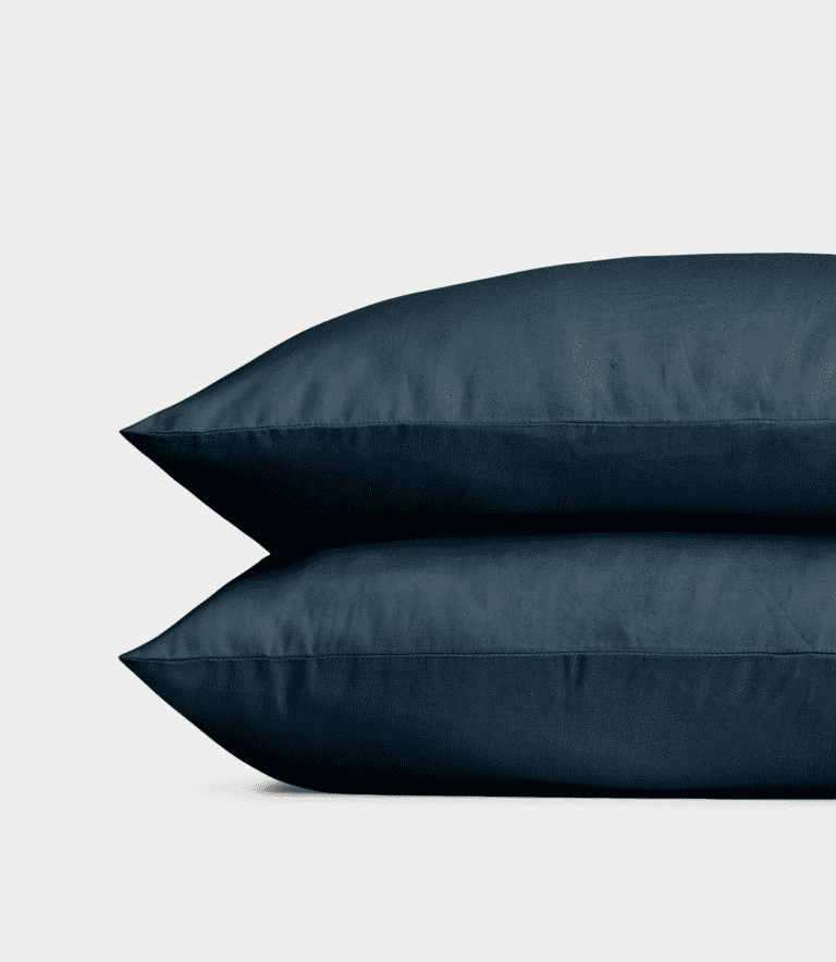 Navy Linen Bamboo Pillow Shams photographed over a white background. |Color: Navy