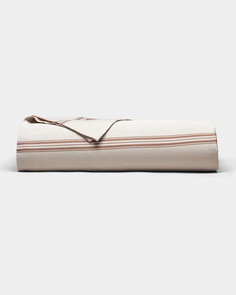 The Cozy Earth Bamboo Sheet Set is neatly folded, featuring a beige color with thin horizontal brown stripes, and displayed against a plain light background.|Color:Baja Stripe in Maple
