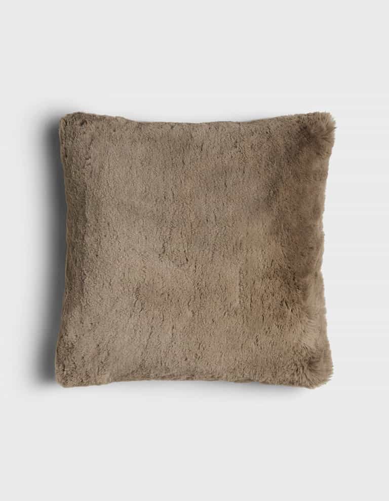 The Cuddle Pillow by Cozy Earth is a square, brown faux fur pillow with a soft, fluffy texture, displayed on a plain white background.|Color:Walnut