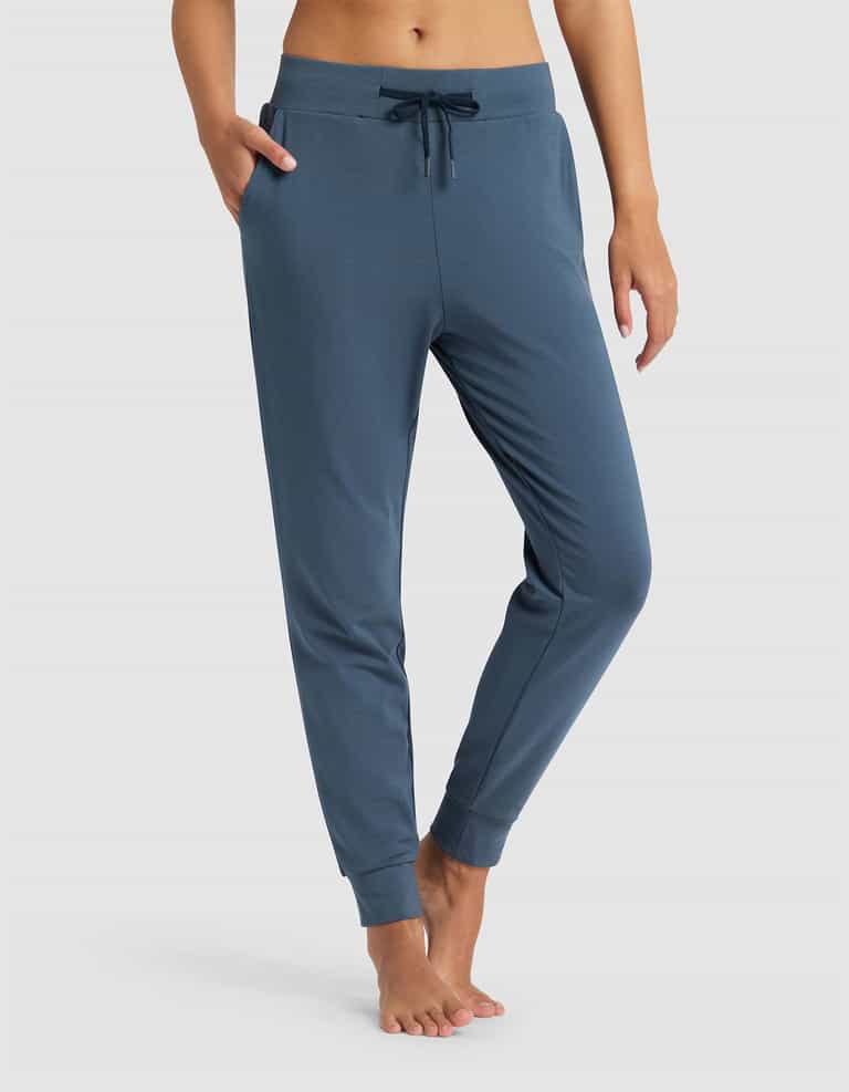 Blue jogger pants worn by a person on a white background |Color:Dawn
