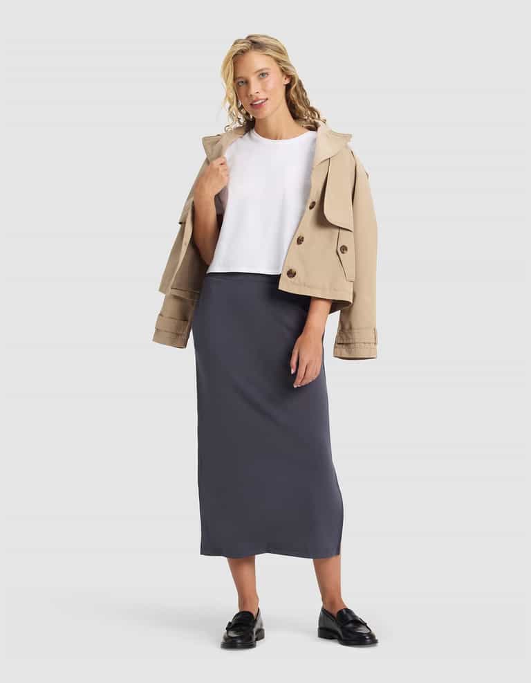 Woman wearing a beige jacket, white shirt, and gray skirt on a white background |Color:Graphite