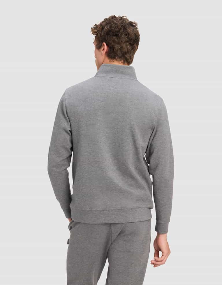 A man with curly brown hair, shown from the back against a light gray background, wears the Cozy Earth Men's StretchTech Quarter Zip in light gray.|Color:Coal Heather