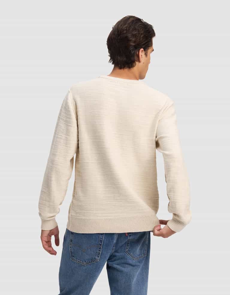 A man with short brown hair wears the Cozy Earth Men's Tate Crewneck in cream and blue jeans, standing with his back to the camera against a plain light gray background.|Color:Alabaster