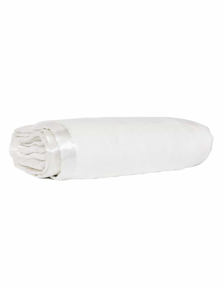 The Cozy Earth Baby Blanket by Cozy Earth, featuring a white color and satin trim, is neatly rolled up and displayed on a white background.