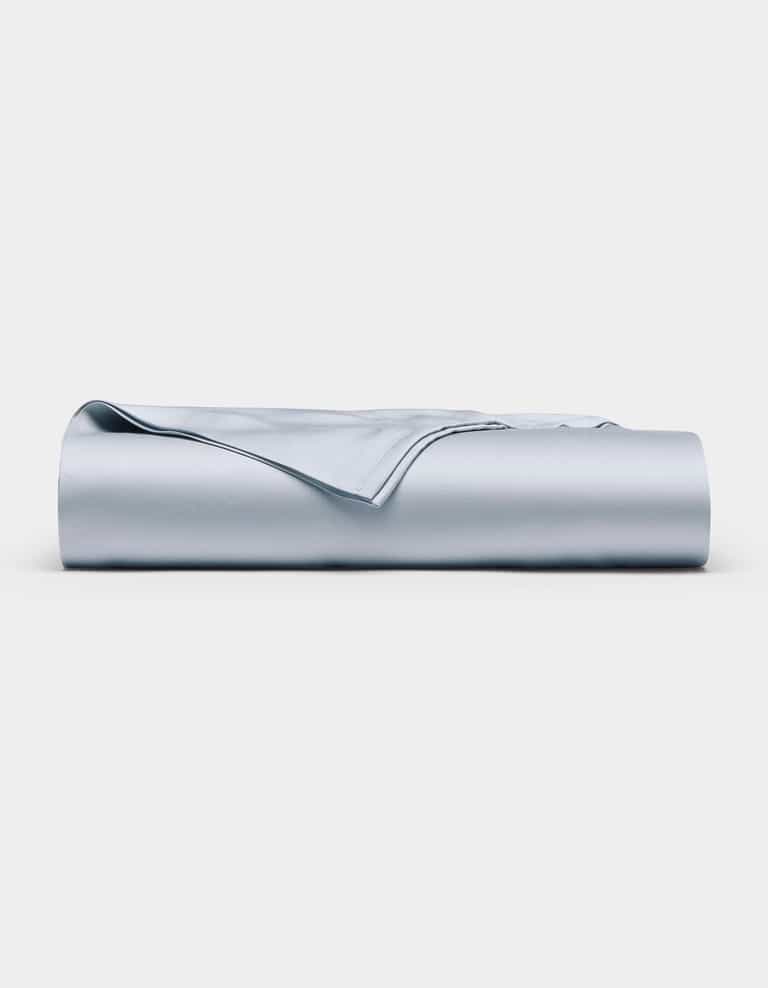 The Cozy Earth Bamboo Flat Sheet in light blue is neatly folded and displayed against a plain white background.|Color:Shore