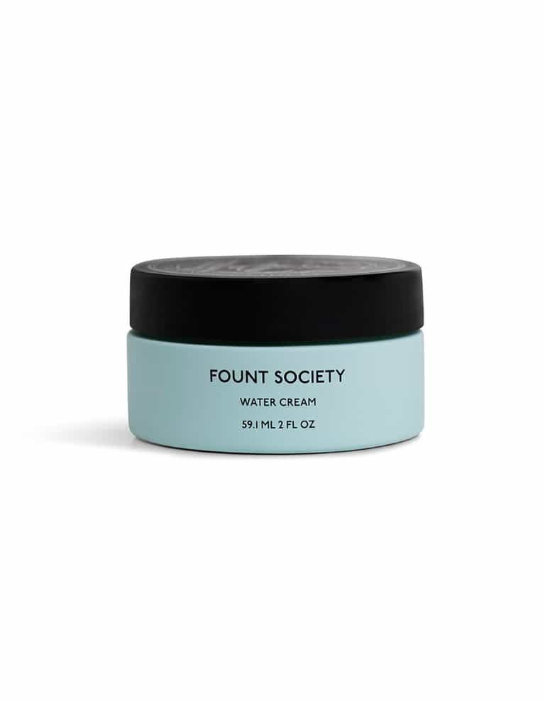 A blue jar of Cozy Earth Water Cream Moisturizer featuring a black lid, with a logo and the text "59 mL / 2 FL OZ" on a plain white background. |Size:Full Size