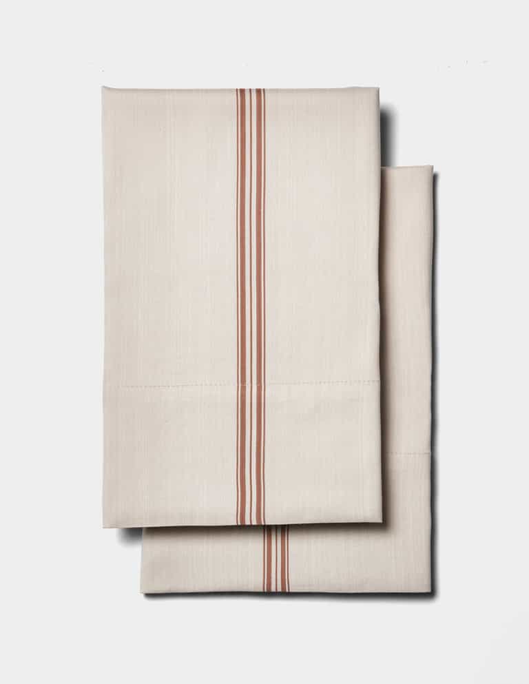 The Cozy Earth Bamboo Sheet Set features a beige design with parallel red stripes down the center, displayed on a plain white background.|Color:Baja Stripe in Maple