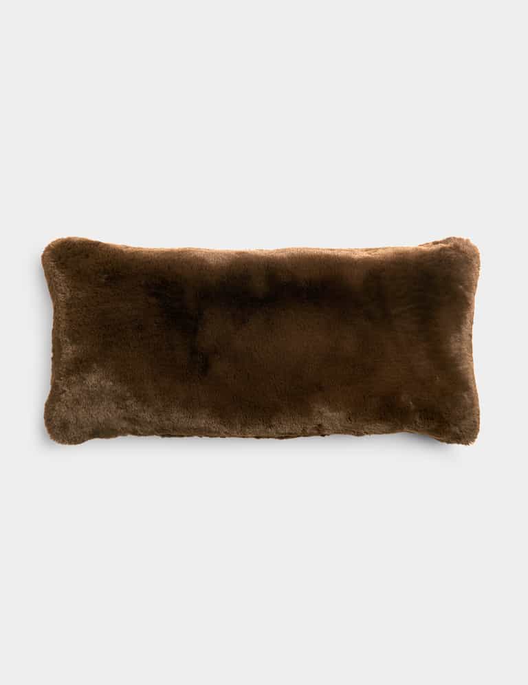 A Cozy Earth Cuddle Pillow in dark brown sits in front of a white background.|Color:Espresso |Size:14" x 30"