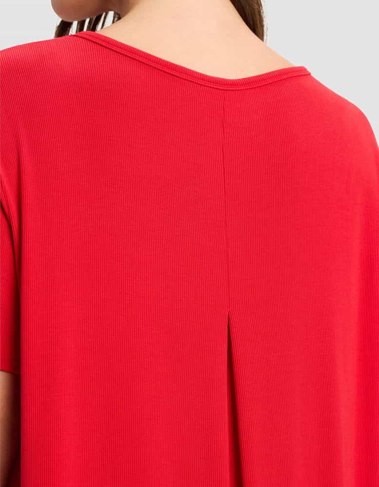 A close-up of a person wearing the Cozy Earth Women’s Bamboo Rib-Knit Boyfriend Sleep Dress, highlighting the back neckline, center pleat detail, and texture of the soft rib-knit fabric.|Color:Crimson