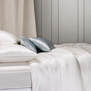Luxury silk bedding set with a soft silk pillow, silk sheet, and the best quality silk comforter, perfect for a comfortable and elegant lifestyle.