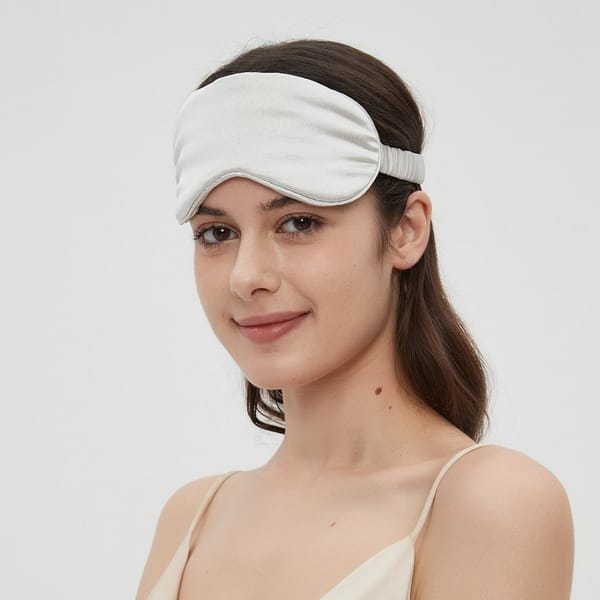 Luxurious Charmeuse silk sleep mask in silver grey by Perle Silk, ultra-soft and breathable, designed for ultimate comfort and restful sleep.